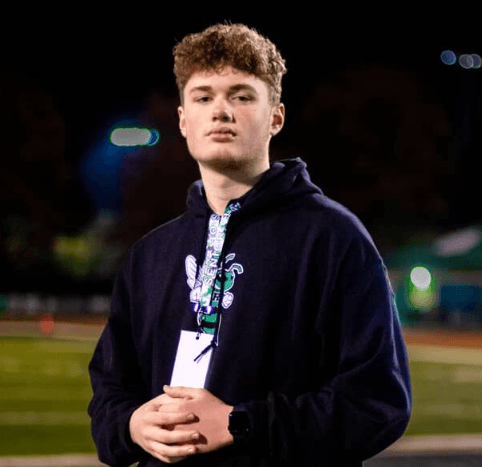 John Schneider on the sidelines at a Georgia high school football game